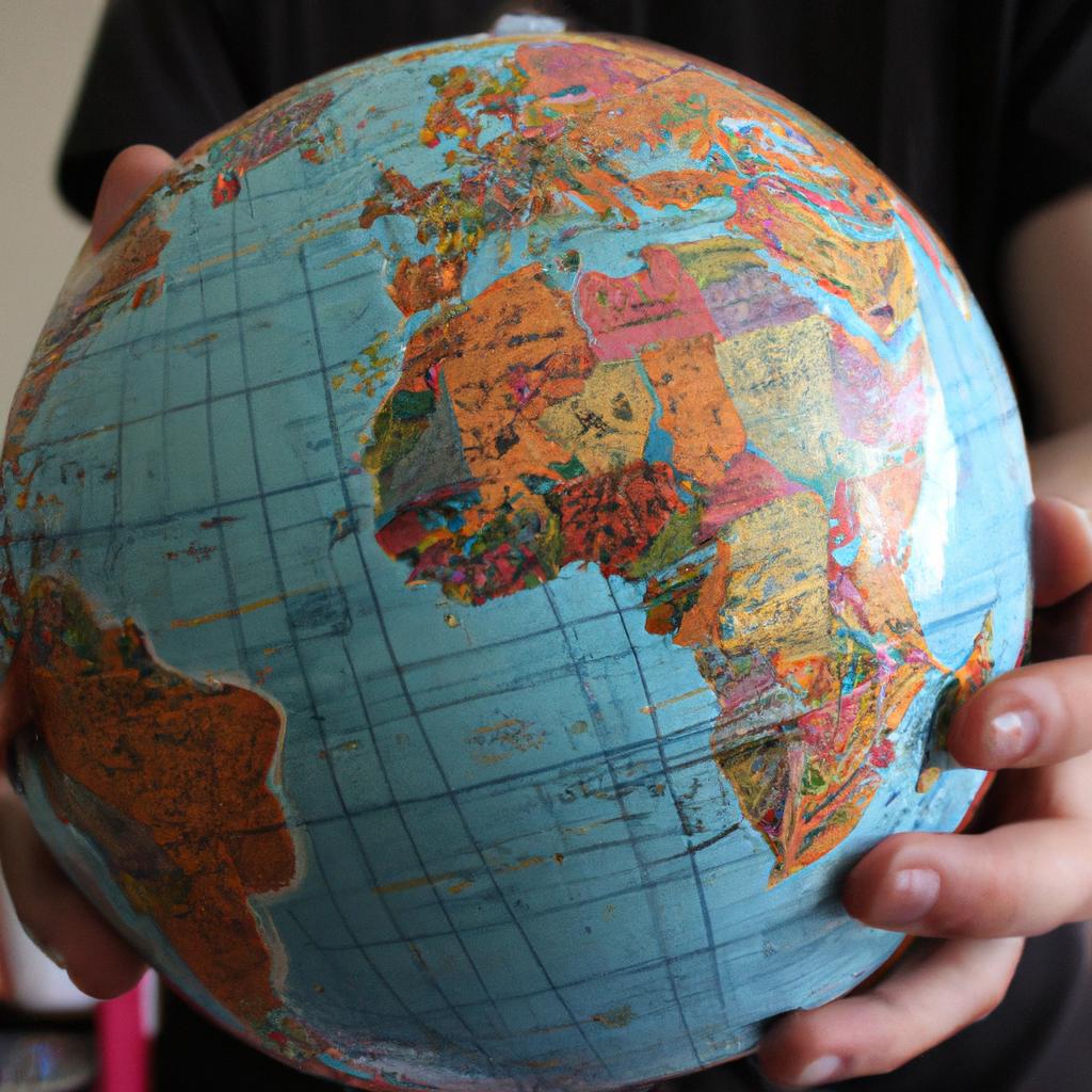 Person holding globe and map